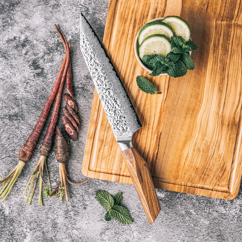 Asiro Kiritsuke on olive wood board slicing fennel