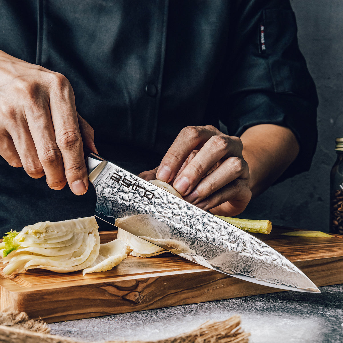 Asiro Chef Knife standing on cutting board with fennel